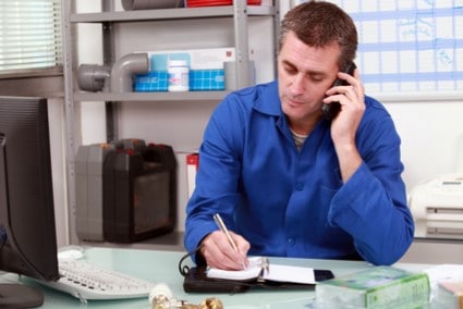 plumber taking a call and making an appointment - Ensor Plumbing